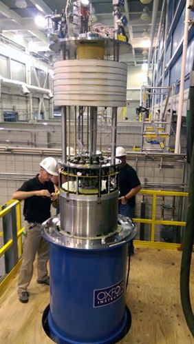 The 32 T is lowered into its cryostat, which keeps the instrument at a very cold operating temperature.