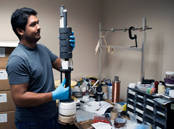 Postdoc Ernesto Bosque with a test magnet.