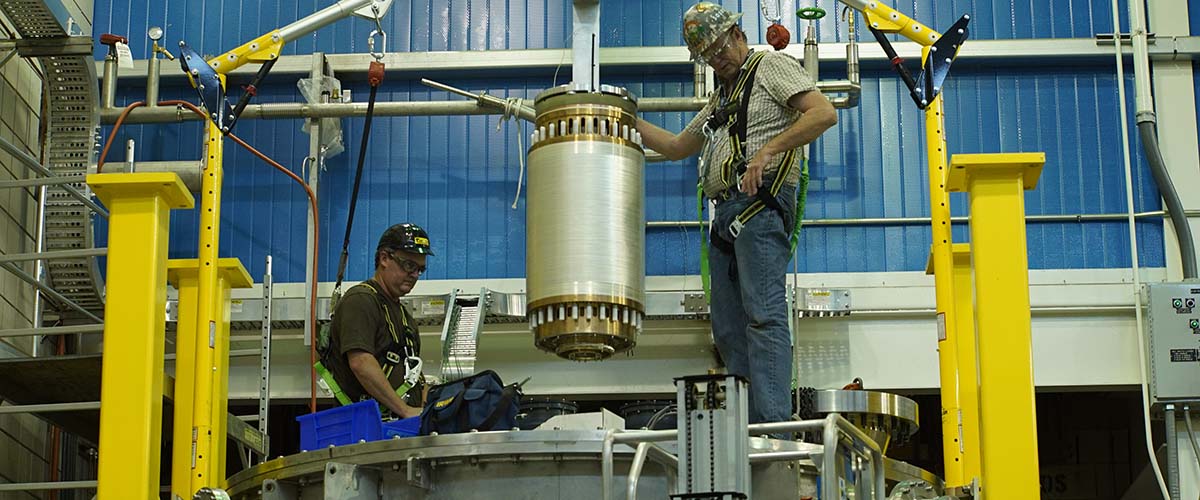 Engineers install the resistive coils of the Series Connected Hybrid magnet inside its superconducting coils. Together, the coils generate a 36-tesla magnetic field.