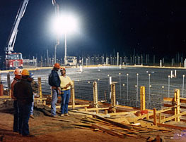 A meter-thick concrete floor is poured for the Continuous (DC) Field Facility.