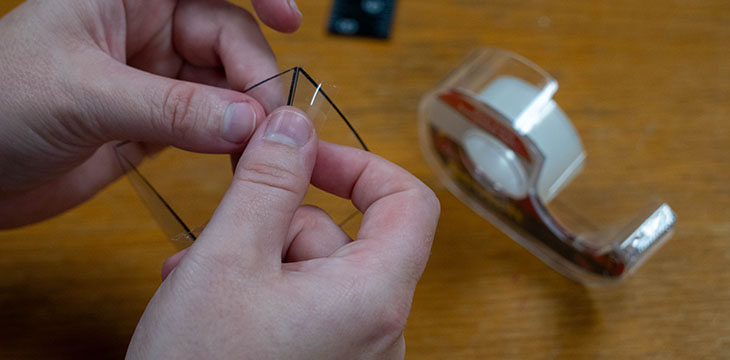 Tape plastic pieces together