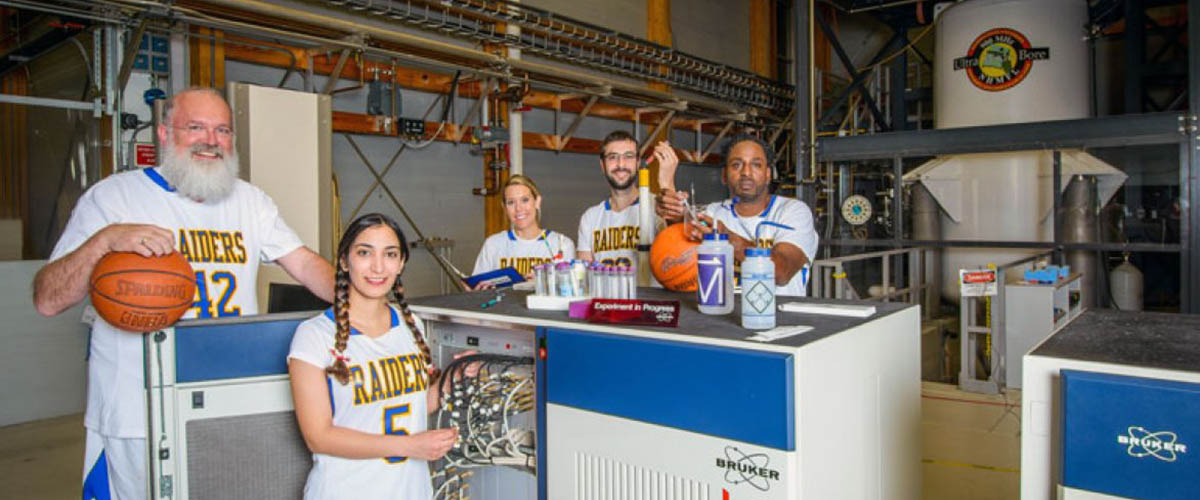 Team captain of the MagLab, Director Greg Boebinger (far left) with fellow team members from across the lab in front of the world-record 900 MHz NMR magnet.