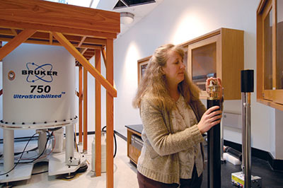 Joanna Long inspects a probe in front of the 750 MHz superconducting magnet at AMRIS.