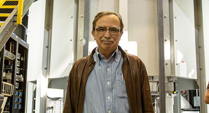 Tim Cross in front of the Series Connected Hybrid magnet, the world's strongest instrument for NMR experiments.