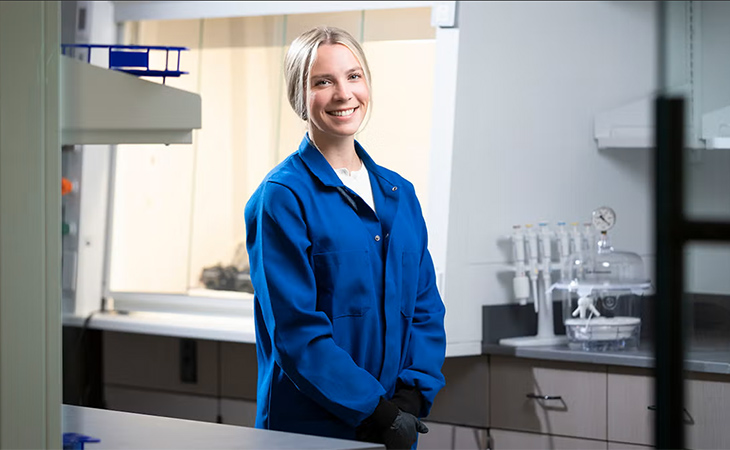 Bailey Lake poses in professor Jamel Ali's lab in the Interdisciplinary Research and Commercialization Building in Tallahassee