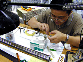 A scientist prepares an experiment for a magnet.