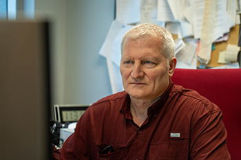 Alexey Suslov, MagLab physicist, researcher, and user support scientist, works in his office.