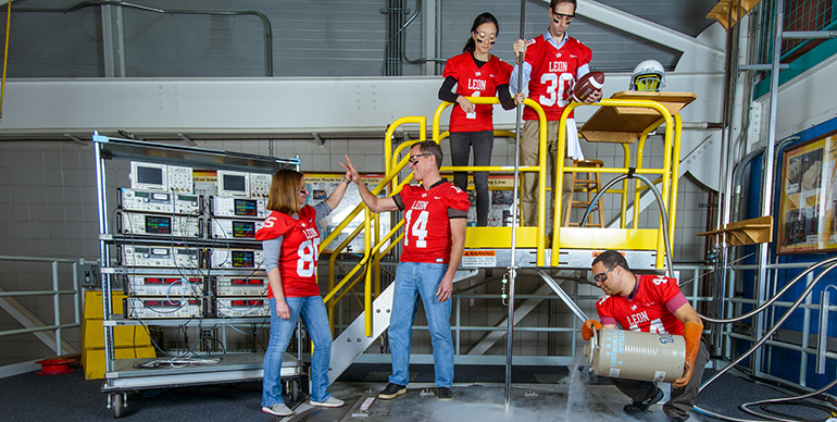 Representing the DC Field Facility team, standing in front of the world-record 45-tesla hybrid magnet, are (from left to right): physicists Audrey Grockowiak, Stan Tozer, Hongwoo Baek, William Coniglio and Jonathan Billings.