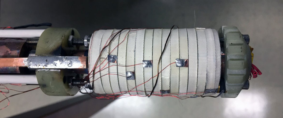 This little coil, about the size of an empty toilet tissue roll, helped scientists achieve a new world record for a continuous magnetic field, 45.5 teslas. The coil was wound using a superconductor called rare earth barium copper oxide (REBCO), then wrapped with white fiberglass tape.