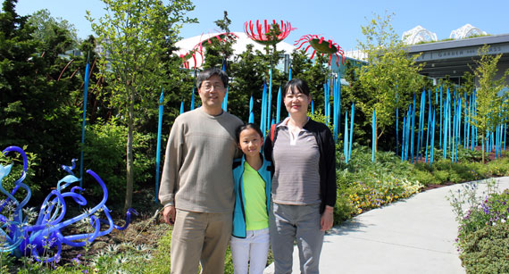 Annette Lu, center, with dad  Jun Lu and mom Yan Xin, both MagLab scientists, at the Chihuly Garden and Glass museum in Seattle.