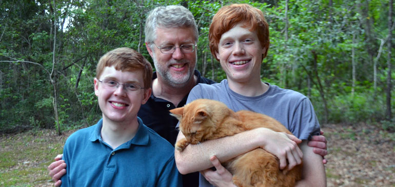 MagLab physicst Bill Brey, center, with sons Jasper (left) and Max (holding Kepler the cat).