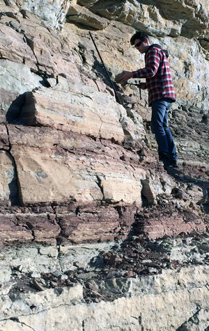 Former FSU graduate student Andrew Kleinberg, a co-author on the paper, collects samples from Silurian limestones in Tennessee.