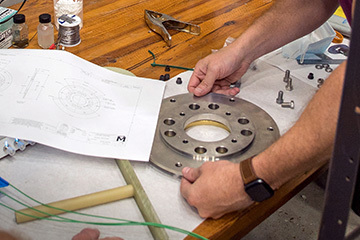MagLab Engineers checking fabricated parts