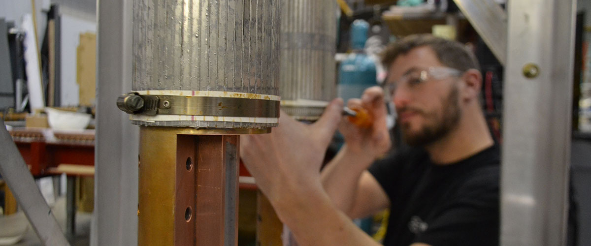 Research engineer Justin Deterding works on the current leads for the 36 tesla series connected hybrid magnet
