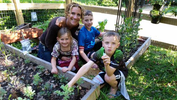 MagLab chemist Amy McKenna and children in their garden.