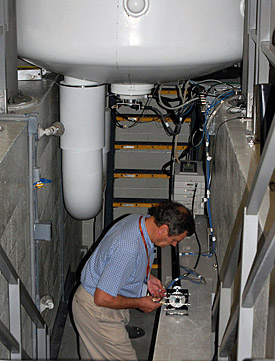 Victor Schepkin prepares to insert a probe containing a rat into the 900 MHz magnet.