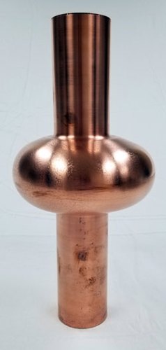 This copper RF cavity, about 1 foot (30 cm) long, would be for a small-scale particle accelerator about 3 feet in length (about 1 meter).