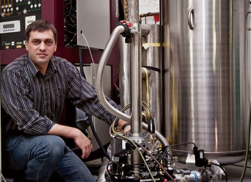 Physicist Irinel Chiorescu beside his lab's pit magnet.