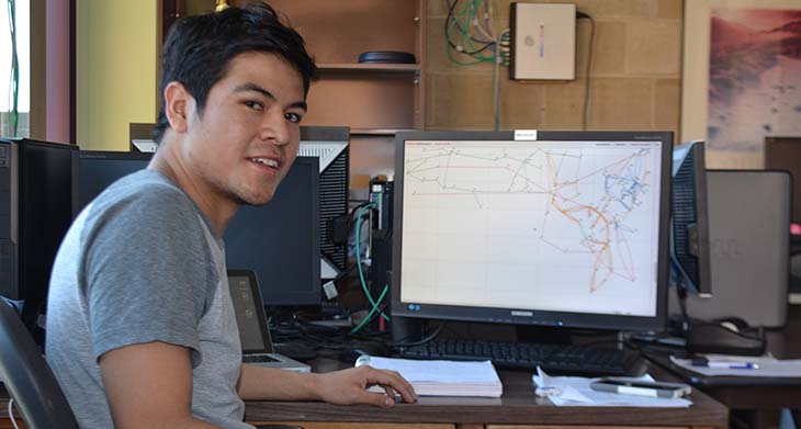 Bridge Fellow Daniel Silva at work on a computer program about electrical grids.