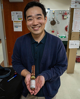 Applied Superconductivity Center researcher Jeseok Bang with the prototype “Little Big Coil” magnet that reached a record 48.7 tesla.