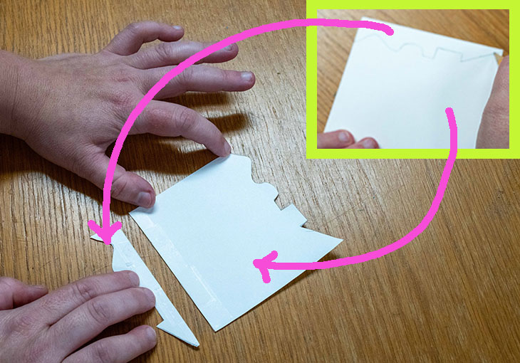 Move a piece of paper straight down to the bottom edge of the card