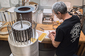 MagLab Engineer stacking bitter plates to form a magnet coil