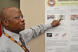 Hilary Dennis explains his lab project during the teachers’ poster presentations.