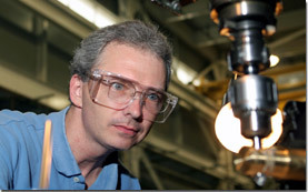 Engineer Andy Rubes machines an instrumentation rotator for a magnet probe.