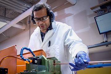 MagLab Engineer fabricating conduit for magnet projects